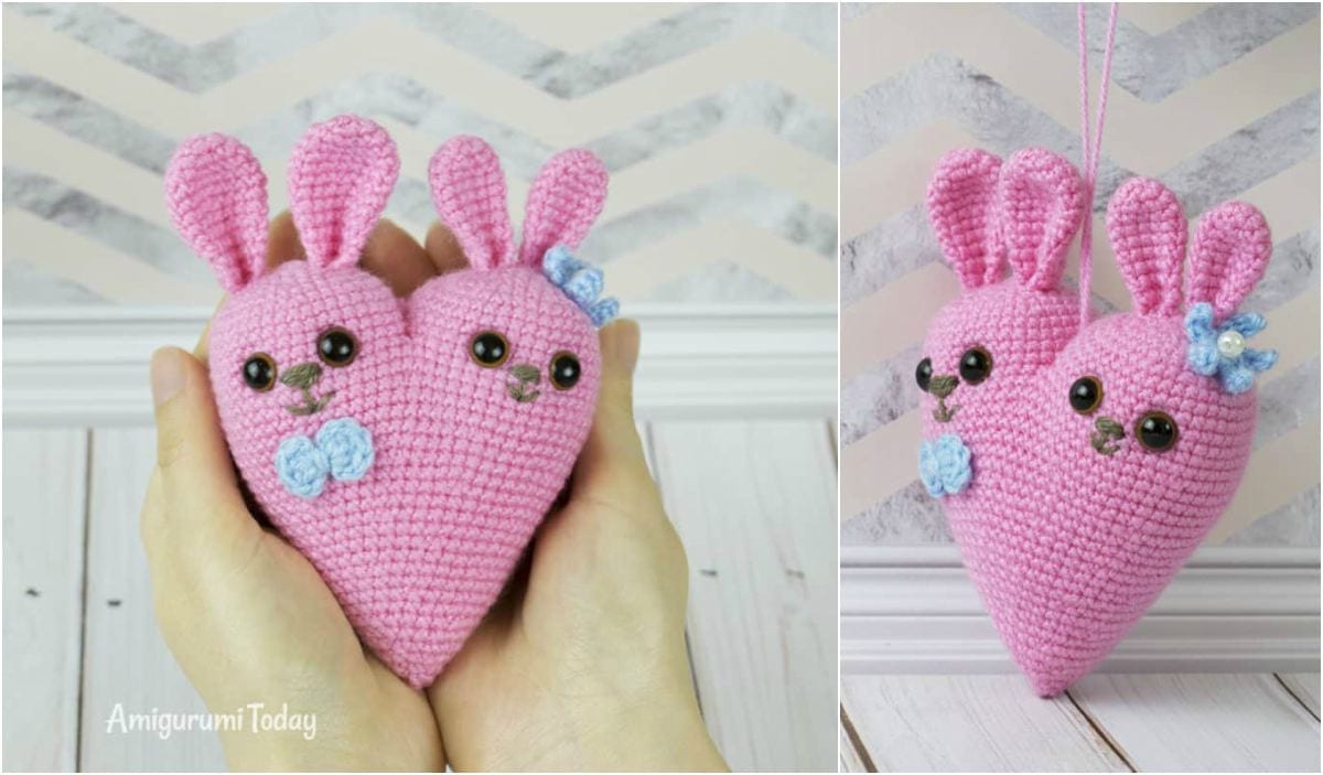 Pink crochet heart with two rabbit faces, each wearing a blue bow. This Bunny Heart Amigurumi is captured in one image held in hands, and another shows it hanging. It's perfect for those looking for a unique free crochet pattern to try.