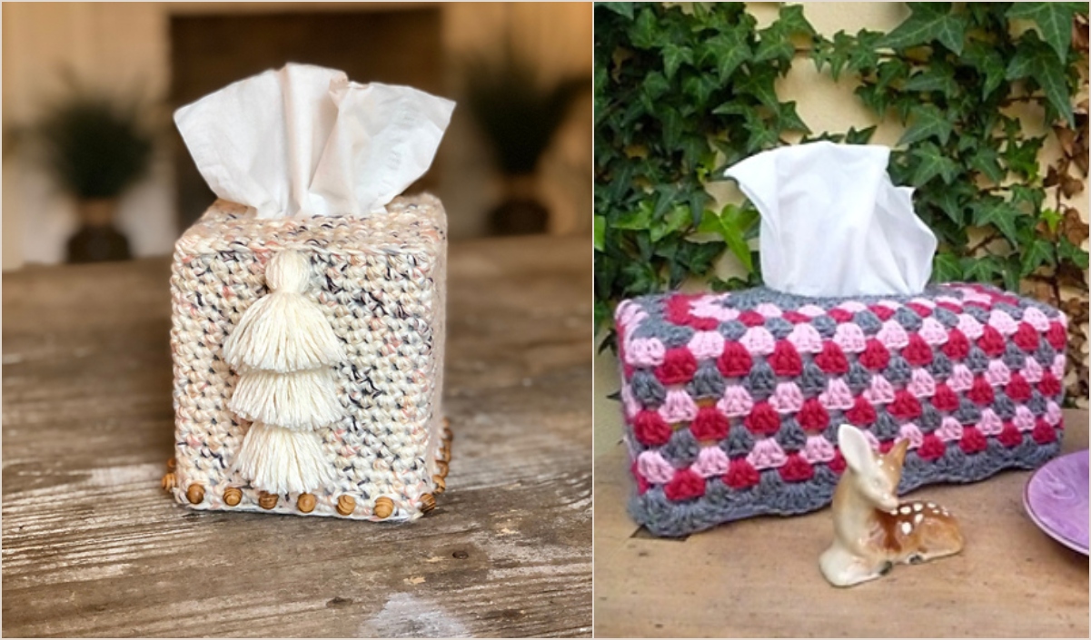 Two decorative tissue boxes rest on a wooden surface outdoors: one features an intricate woven cover with tassels, while the other displays a stunning crochet design in shades of gray, pink, and red, showcasing the beauty of tissue box cover crochet.